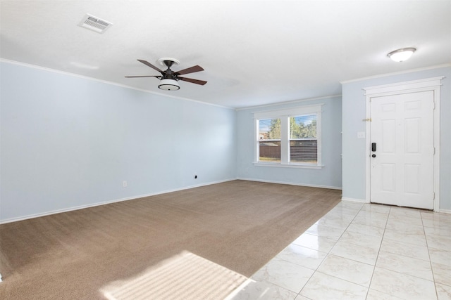 interior space with ceiling fan and ornamental molding