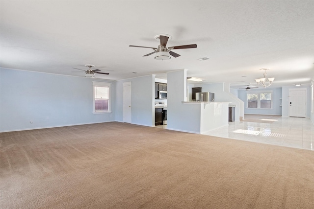 unfurnished living room featuring light colored carpet and a chandelier