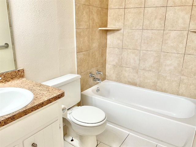 full bathroom featuring tile patterned flooring, vanity, toilet, and tiled shower / bath combo