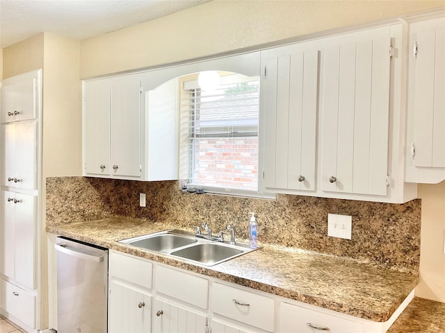 kitchen featuring dishwasher, white cabinetry, and sink