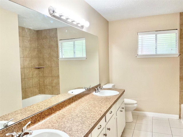 full bathroom featuring tile patterned floors, plenty of natural light, toilet, and vanity