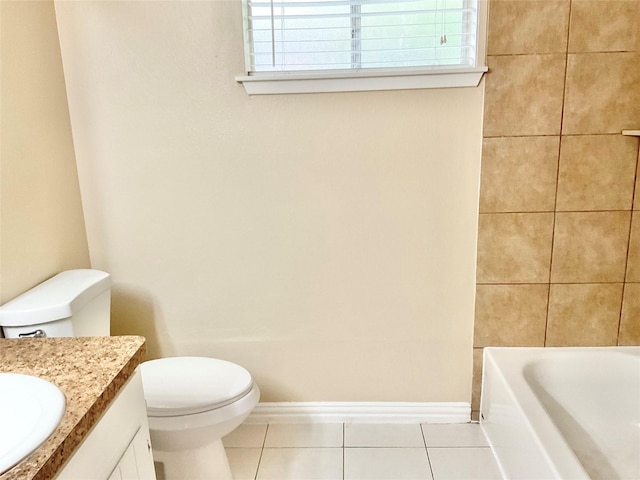 bathroom featuring tile patterned flooring, vanity, and toilet