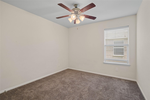 spare room with ceiling fan and carpet floors