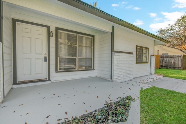 doorway to property featuring covered porch