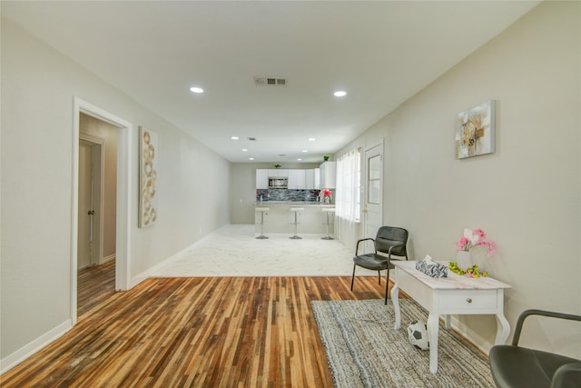 corridor featuring hardwood / wood-style flooring