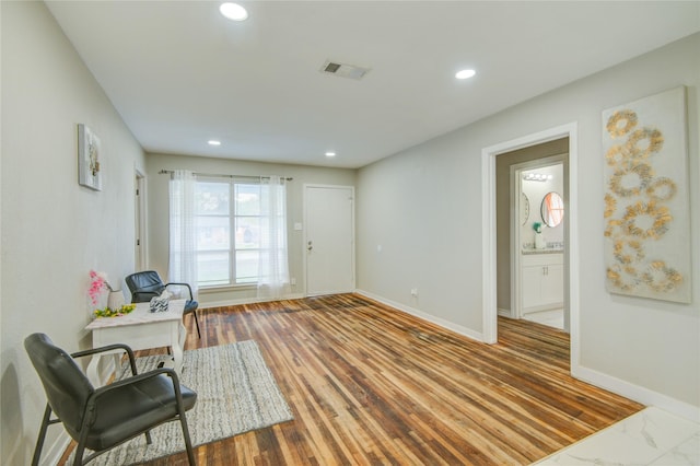 living area with hardwood / wood-style flooring