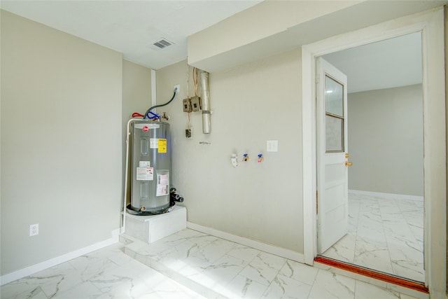 utility room featuring water heater