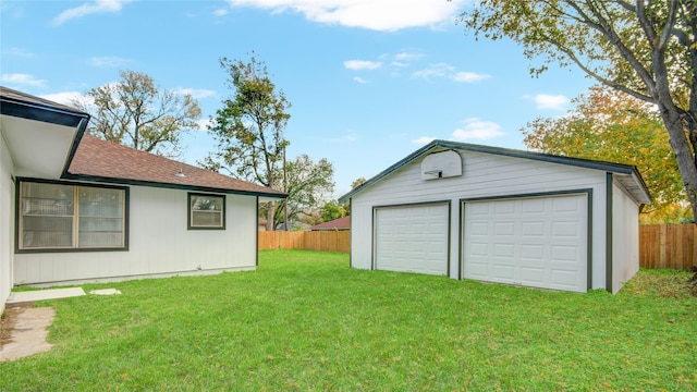 garage featuring a lawn