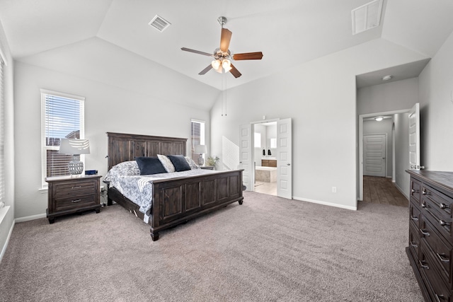 bedroom with lofted ceiling, visible vents, and light colored carpet