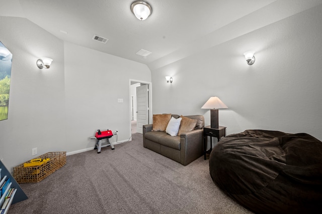 living area with carpet, visible vents, vaulted ceiling, and baseboards