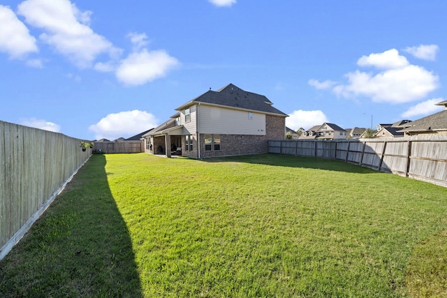 view of yard with a fenced backyard