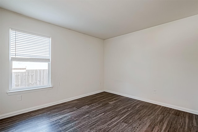 unfurnished room featuring dark hardwood / wood-style flooring