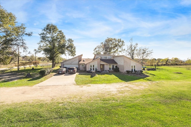 exterior space with a yard and a garage