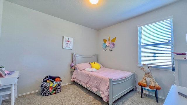 bedroom with light colored carpet