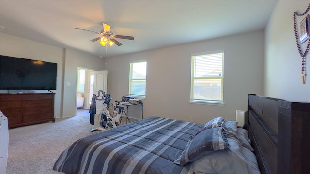 bedroom featuring light colored carpet and ceiling fan