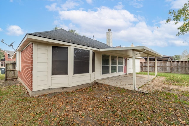 back of house with a patio