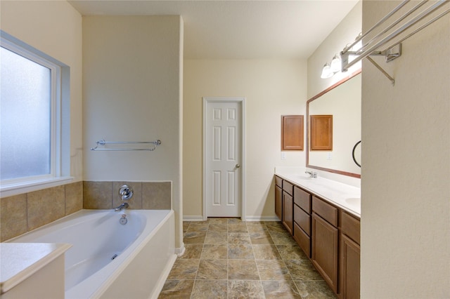 bathroom with a bath and vanity