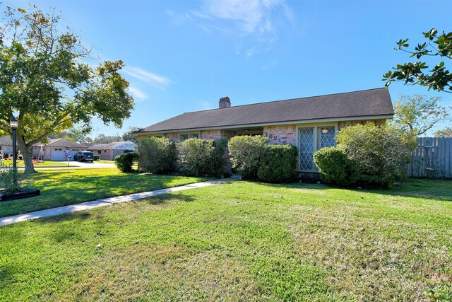 ranch-style house with a front lawn