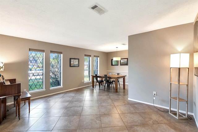 dining space with tile patterned flooring