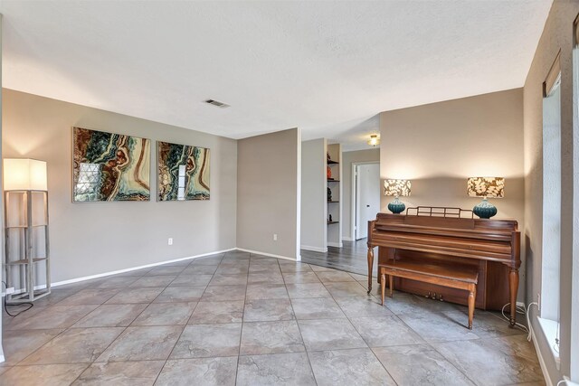 empty room with a textured ceiling