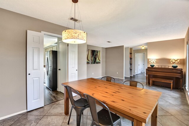 dining space featuring wood-type flooring