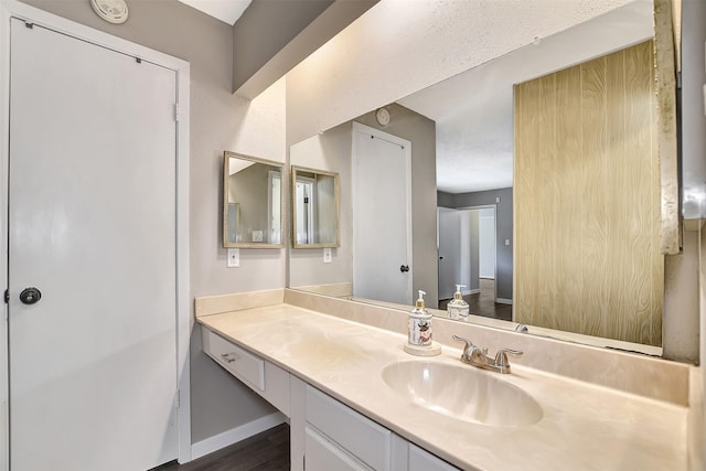 bathroom featuring vanity and wood-type flooring