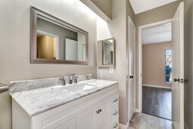 bathroom featuring vanity and wood-type flooring