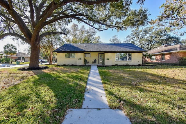 ranch-style home with a front lawn