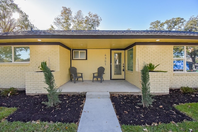 property entrance featuring a patio