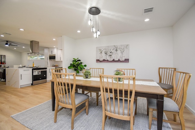 dining room featuring ceiling fan and light hardwood / wood-style floors