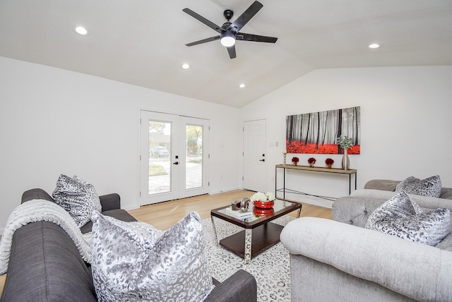 living room featuring hardwood / wood-style flooring, ceiling fan, lofted ceiling, and french doors