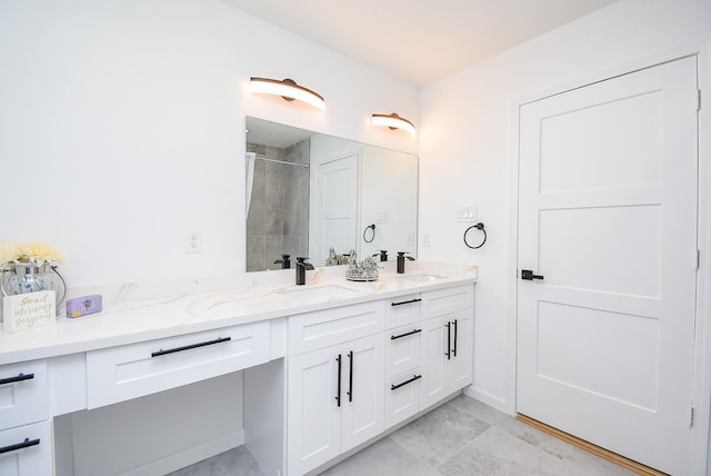 bathroom with vanity and an enclosed shower