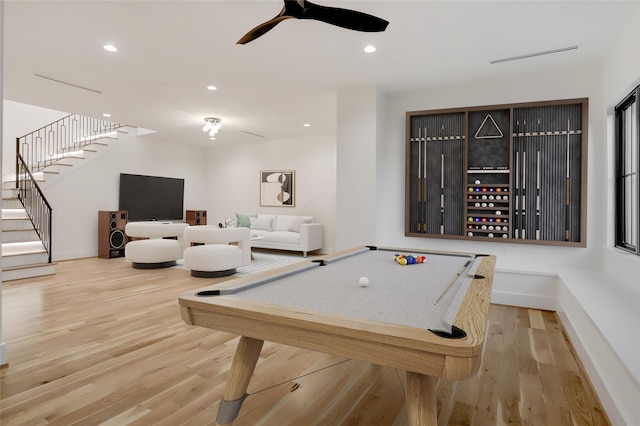 game room with hardwood / wood-style floors and pool table