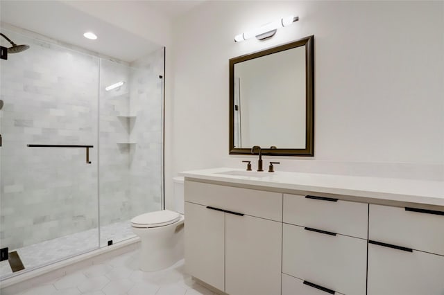 bathroom featuring tile patterned floors, toilet, vanity, and walk in shower