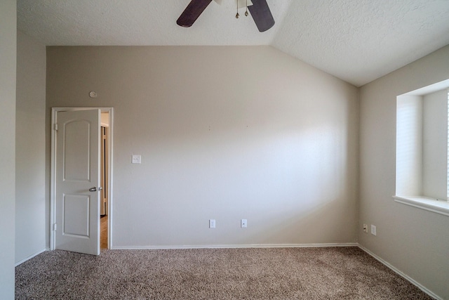 unfurnished room with ceiling fan, carpet floors, a textured ceiling, and vaulted ceiling