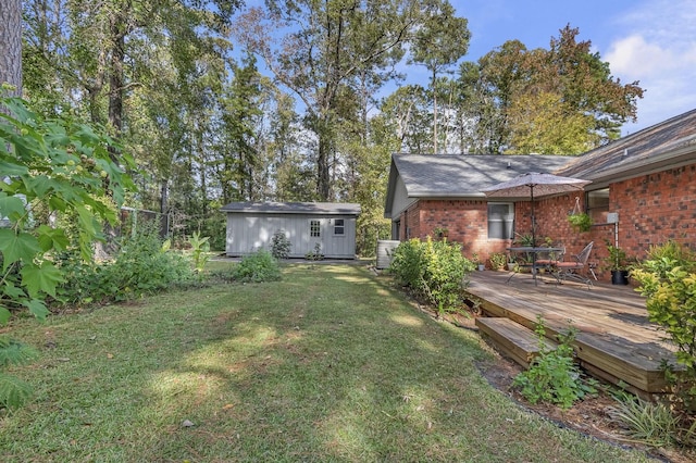 view of yard featuring an outbuilding and a deck