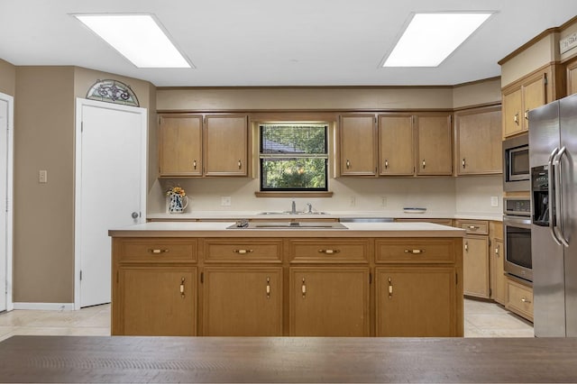 kitchen featuring sink, light tile patterned floors, and appliances with stainless steel finishes