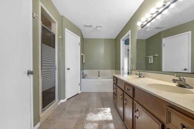 bathroom with tile patterned floors, vanity, and plus walk in shower