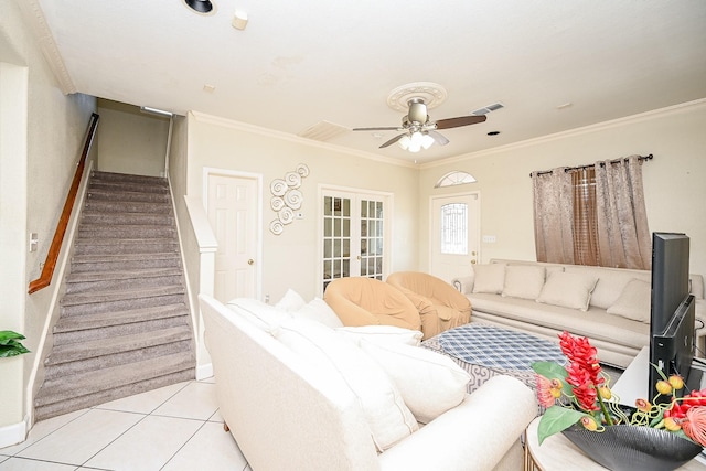 tiled living room featuring ceiling fan and ornamental molding