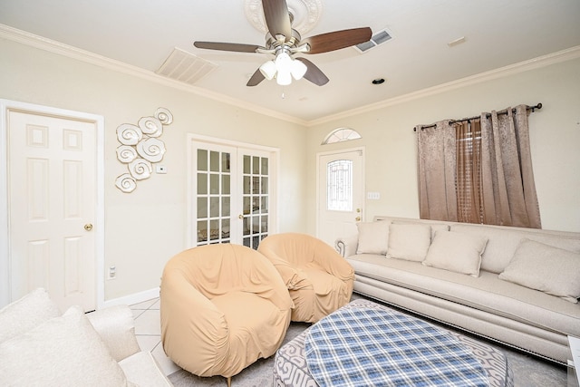 tiled living room featuring ceiling fan, ornamental molding, and french doors