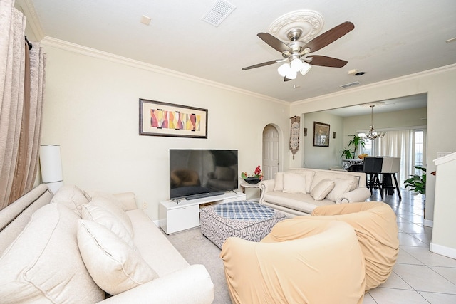 tiled living room featuring ceiling fan with notable chandelier and crown molding