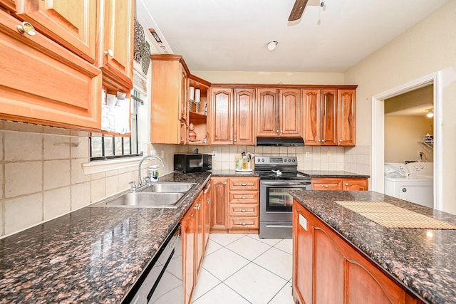 kitchen with backsplash, sink, independent washer and dryer, light tile patterned floors, and stainless steel appliances