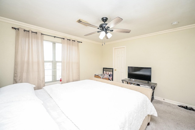 bedroom featuring ceiling fan, ornamental molding, and light carpet