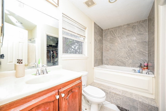 bathroom featuring tile patterned flooring, vanity, and toilet