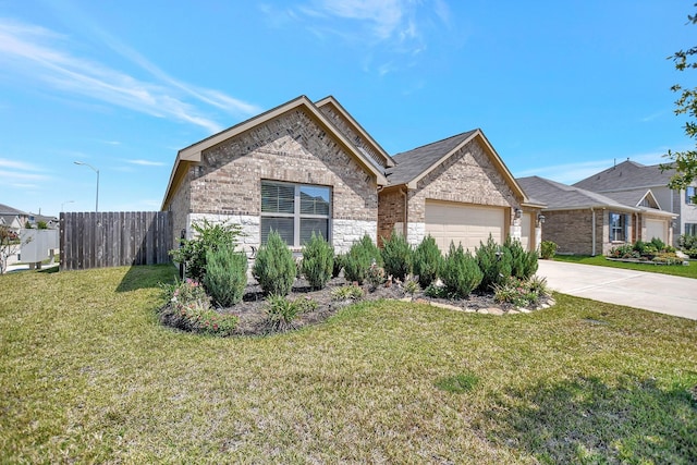 view of front of property with a front yard and a garage