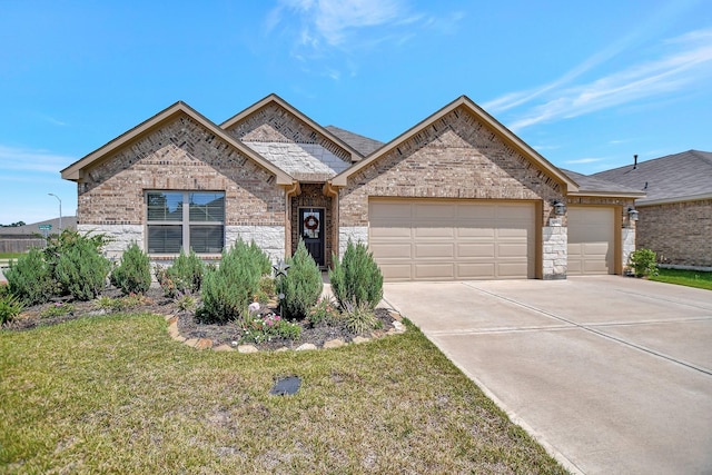 view of front of property with a front yard and a garage