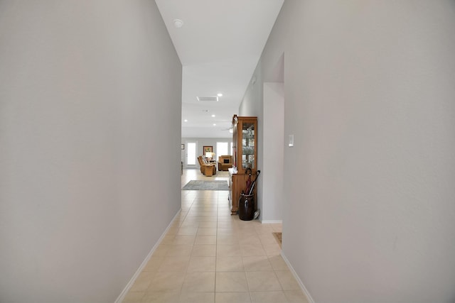 corridor featuring light tile patterned floors