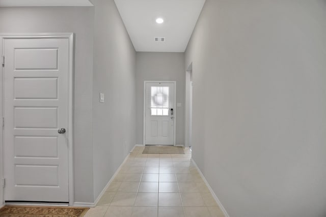 doorway to outside featuring light tile patterned floors