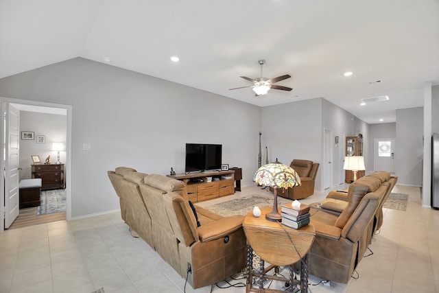 tiled living room with ceiling fan and lofted ceiling