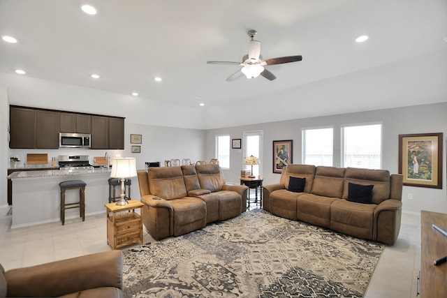 tiled living room featuring ceiling fan